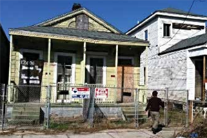 Before: Redmellon Restoration & Development took on a major rehabilitation of this abandoned duplex in New Orleans. (Redmellon Restoration & Development)