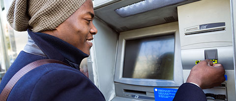 Man using ATM